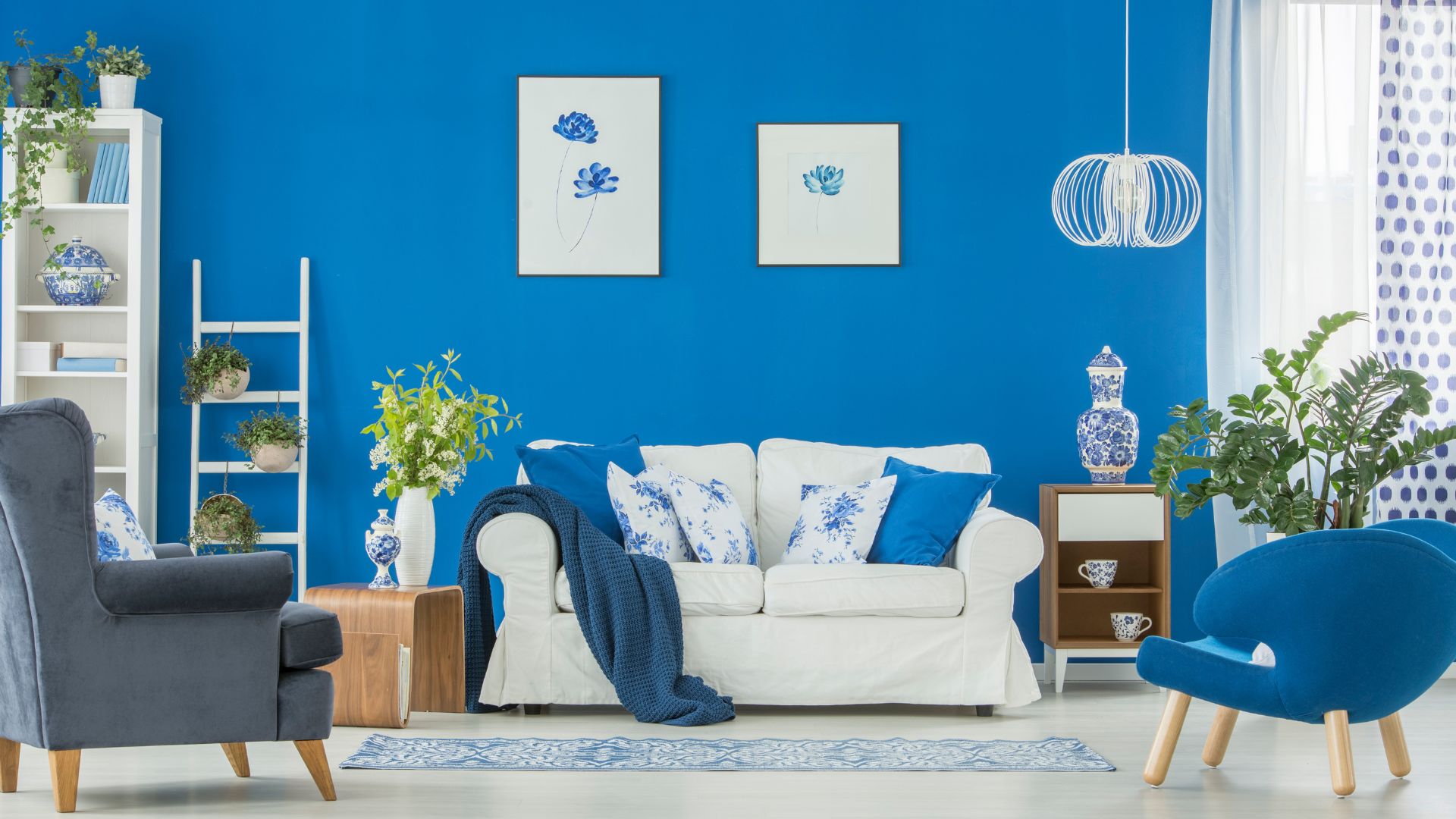 Living room freshly painted with a bright blue accent wall