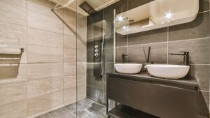 Modern bathroom with double vessel sinks and a glass shower