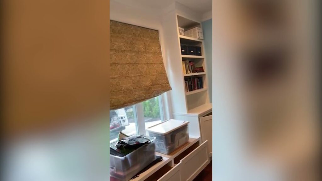 Carpentry project with built-in shelving next to a window
